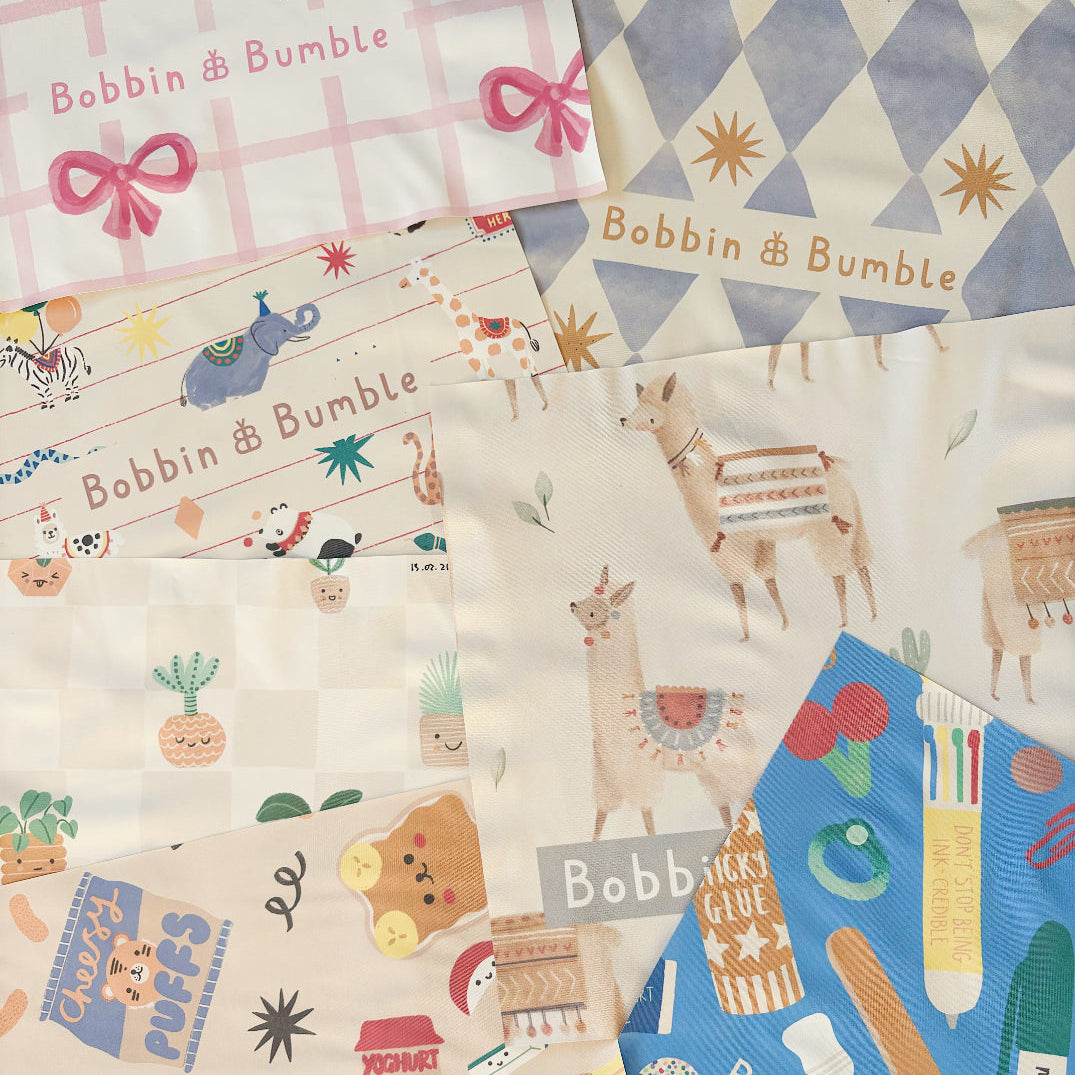 Collection of splash mat swatches with various patterns and branding, including 'Bobbin & Bumble'.