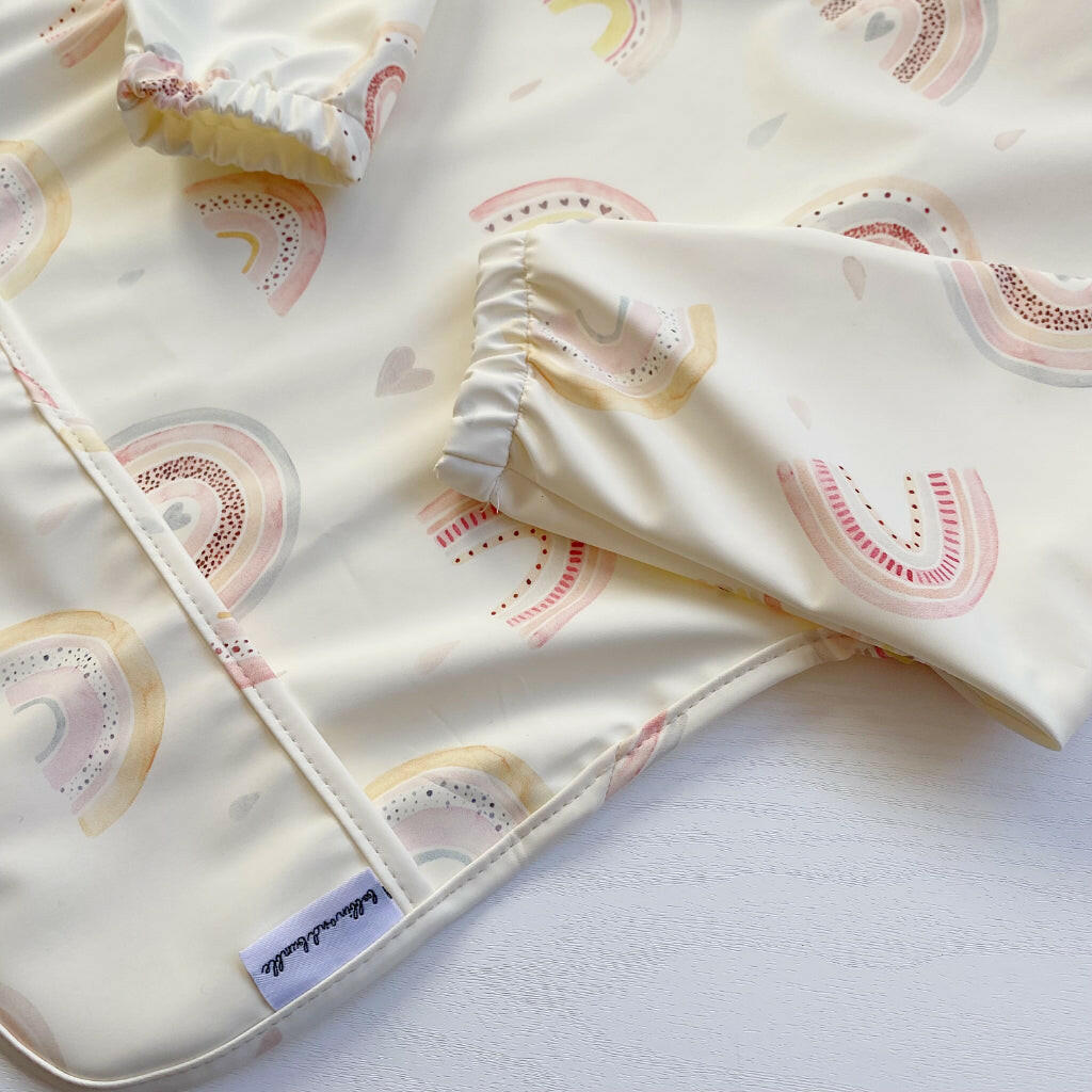 Long Sleeved Baby Bib - Rainbow print | Bobbin and Bumble.