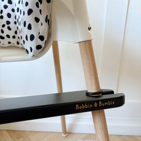 Bobbin and bumble branded black footrest on baby IKEA highchair