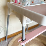 Pink IKEA highchair accessories with 'Bobbin & Bumble' branding in a home setting.