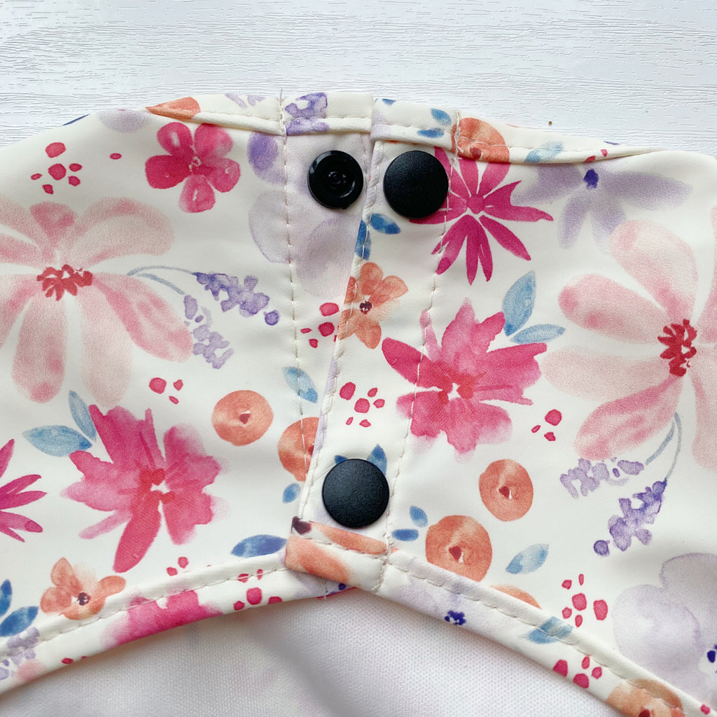 Long Sleeved Baby Bib - Pink Floral Print | Bobbin and Bumble.