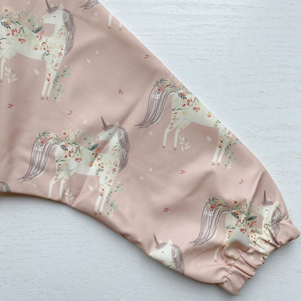 Long Sleeved Baby Bib - Pink Unicorn Print | Bobbin and Bumble.