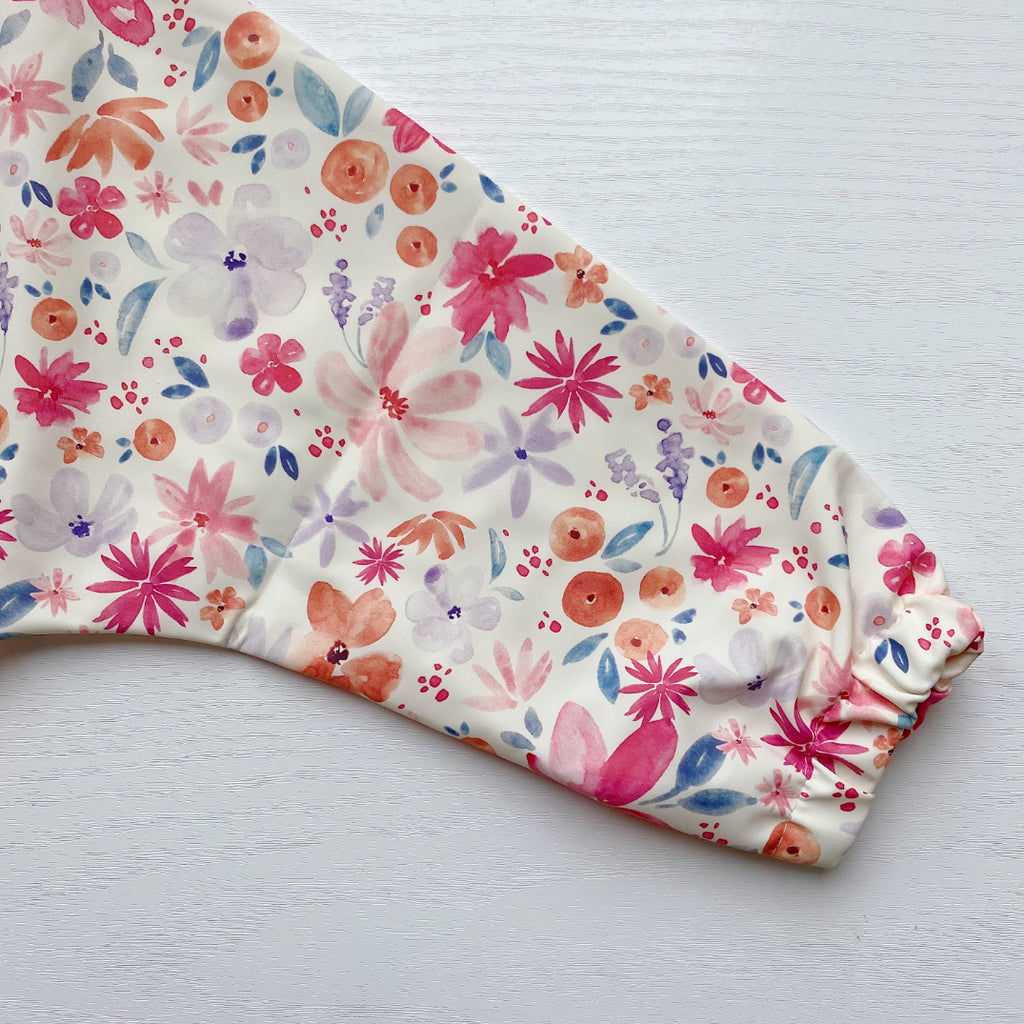 Long Sleeved Baby Bib - Pink Floral Print | Bobbin and Bumble.