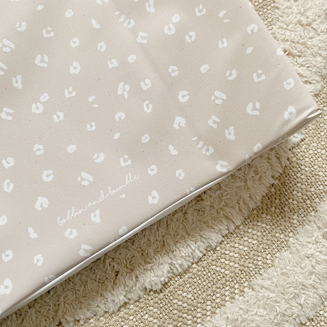 Anti-Roll Wedge Baby Changing Mat - Sand Animal Print | Bobbin and Bumble.